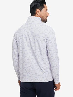 Back upper body angle of the brown grey camo full print quarter zip pullover, model turns head slightly.