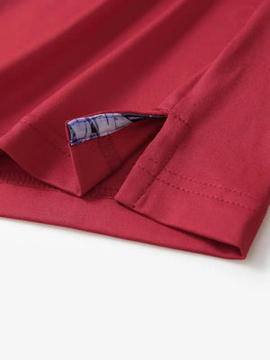 Close-up of side slit detail on the Red Everyday Classic Solid Polo hem
