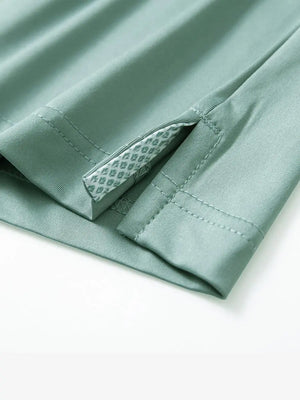 Close-up of side slit detail on the Beryl Green Everyday Classic Solid Polo hem
