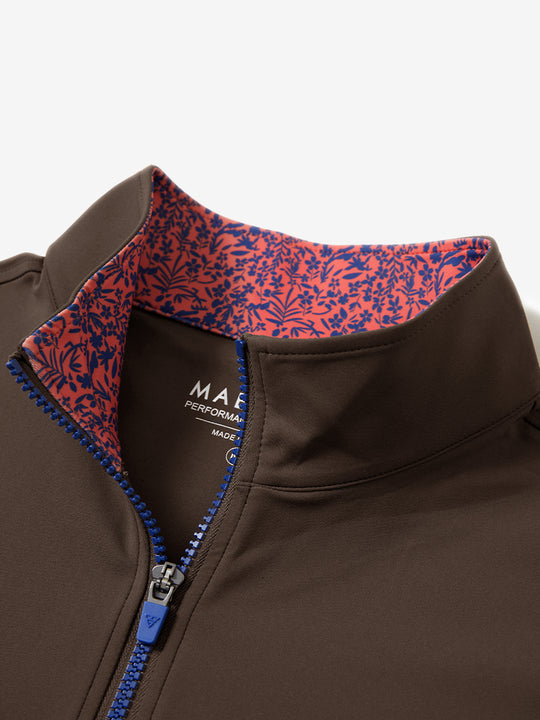 Zipper and inner pattern detail of the print collar quarter zip golf vest in coffee brown, highlighting design.