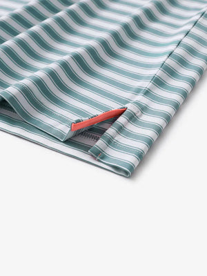 Close-up of the hem slit on the Haze Blue White Yarn Dyed Stripe Polo – tailored and functional
