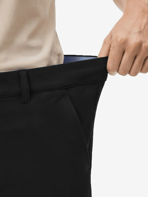 Detail view of elastic waistband on black women's regular fit stretchy golf pants