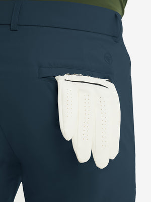 Close-up of the back pocket detail on the navy stretch soft flat front dress golf shorts, emphasizing storage