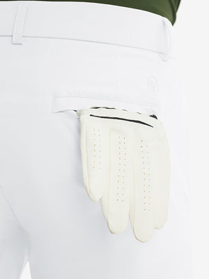 Close-up of the back pocket detail on the white stretch soft flat front dress golf shorts, emphasizing storage