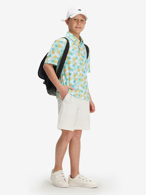 Full front: boy in leaves pineapple performance print boys golf polo with backpack.