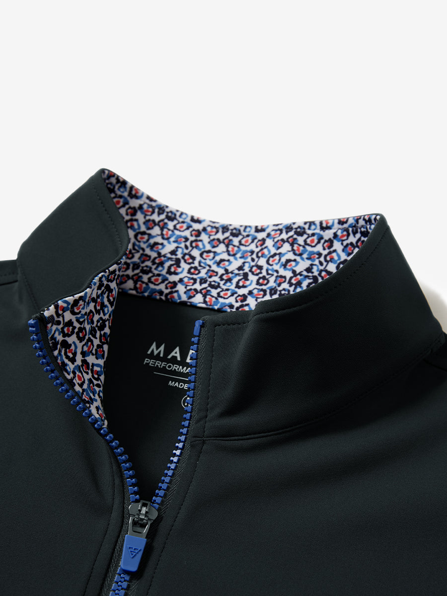 Zipper and inner pattern detail of the print collar quarter zip golf vest in dark grey, highlighting design.