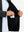 Close-up of winter thermal outdoor water resistant fleece jacket pocket holding a phone, practical detail in black