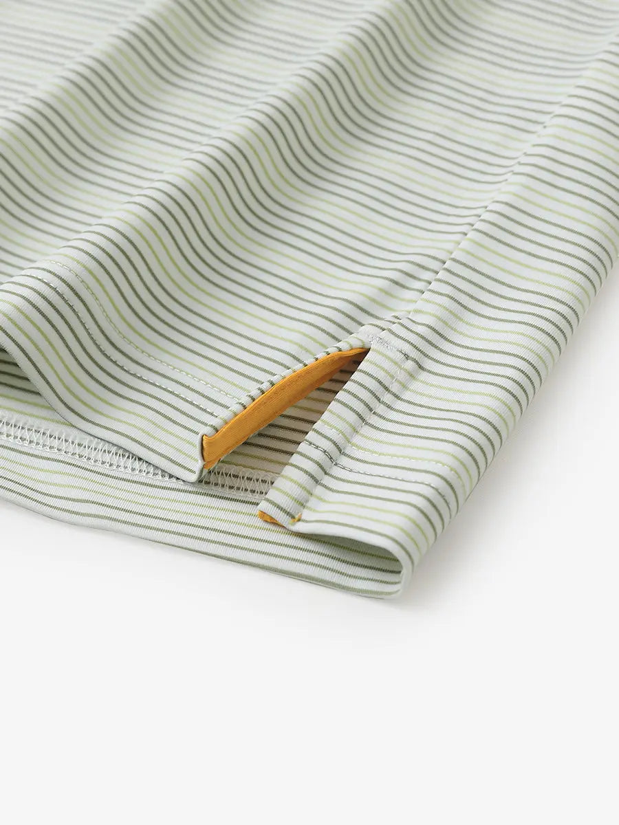 Close-up of side hem slit on Olive Green Grass Green Performance Stripe Golf Shirt
