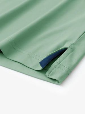 Hem slit detail of BERYL GREEN Stylish Chest Print Snap Polo highlighting stitching and finish