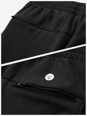 Close-up of the zipper detail of black fleece stretch water resistant boys joggers.
