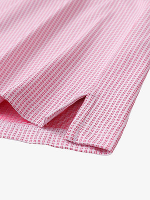 Close-up detail of hem slit on ROSE Elegant Performance Jacquard Polo