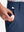 Detail: pocket of dark blue boys lightweight dry fit flat front golf shorts