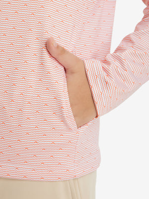 Model with both hands in pockets wearing youth full print stylish hoodies pullover in orange sea wave.