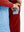 Close-up of the front side pocket detail on kids soft lightweight fleece lined jacket in red, showing quality stitching.