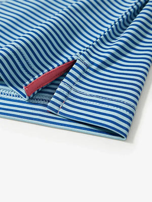 Hem slit detail on AQUA STRIPE polo, designed for ease of movement during your swing