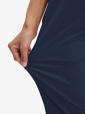 Close-up of the fabric stretch on the navy women's lightweight high waisted golf pants, emphasizing flexibility