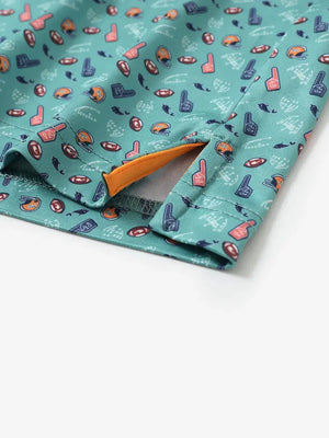 Detailed close-up of side hem slit on GREEN RUGBY Performance Print Boys Golf Polo for comfort