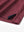 Close-up of side slit detail on BURGUNDY Chest Print Polo Shirts