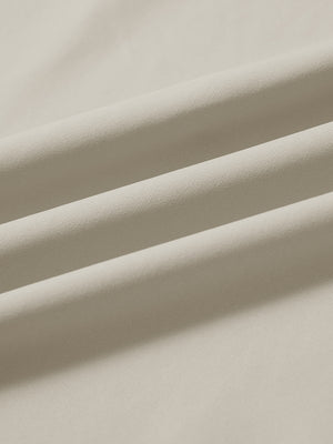 Close-up fabric detail of lightweight golf quarter zip pullover, smooth texture and breathable feel in khaki light