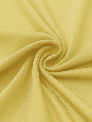 Close-up of yellow women's performance solid polo fabric texture.