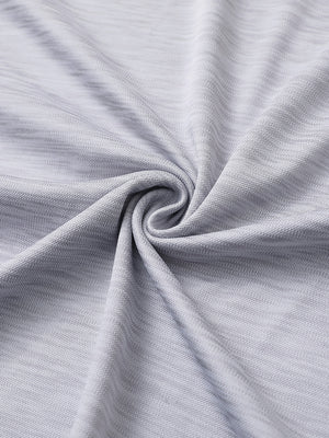 Close-up of faded denim heather texture polo fabric showing soft surface.