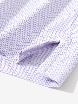 Front half-body view of a model wearing the lavender feather weight jacquard polo shirts, showing the chest pocket