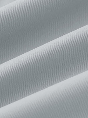 Fabric close-up of Women's 7/8 ankle golf track pants with soft texture in glacier grey