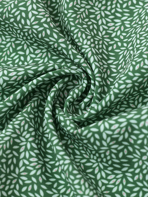Fabric close-up of Stylish printing summer shirt with lightweight feel in green small leaf