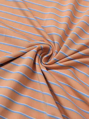 Close-up fabric view of youth performance golf polos, smooth texture with breathable orange/sky blue stripe finish