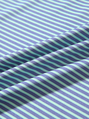 Texture close-up of Kids stripe golf polos with soft fabric and bright green ash stripe stripes