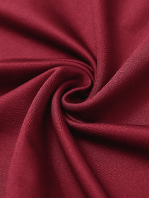 Fabric close-up of Stretch solid fleece quarter-zip vest with soft feel and red detail