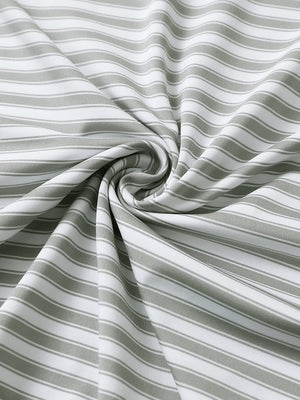 Close-up of grey white yarn dyed stripe polo fabric showing distinct woven stripes and textured surface.