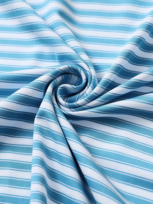 Close-up of sky blue white yarn dyed stripe polo fabric showing distinct woven stripes and textured surface.