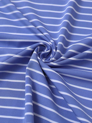 Close-up fabric view of youth performance golf polos, smooth texture with breathable bluish blue/white stripe finish