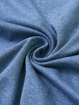 Close-up fabric detail of skin-friendly long sleeve melange polo, soft blend texture with blue heather tone