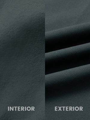 Close-up of inside and outside fabric of water-resistant fleece golf vest in dark grey, highlighting material texture and durability for optimal performance.