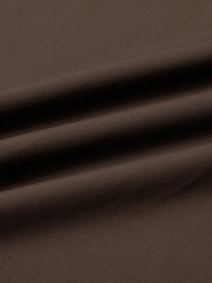 Fabric close-up of print collar quarter zip golf vest, smooth material with subtle texture in coffee brown