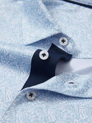 Detail shot of the collar on the light blue line leaf 4 way stretch print collared polo shirt, emphasizing the classic neckline design