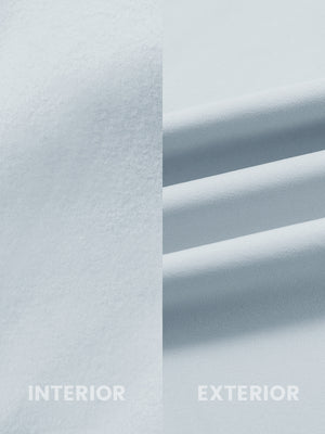 Close-up of inside and outside fabric of water-resistant fleece golf vest in misty grey, highlighting material texture and durability for optimal performance.