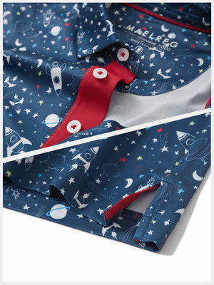 Detail: collar and hem slit of space rocket performance print boys golf polo