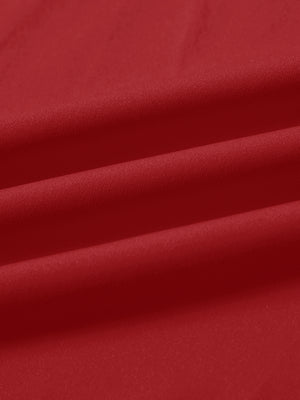 Fabric close-up of print collar quarter zip golf vest, smooth material with subtle texture in red