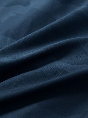 Close-up fabric texture detail of navy water-resistant short sleeve q-zip hoodie for boys