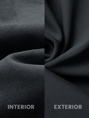 Close-up fabric detail of water-resistant fleece lined pants, soft inner lining and durable dark grey exterior