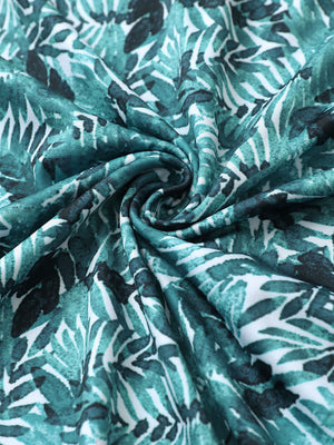 Fabric close-up of Everyday performance print polo with lightweight texture in dark green leaf