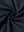 Close-up texture of  navy warm puffer winter golf jacket fabric showing detailed premium material and weave
