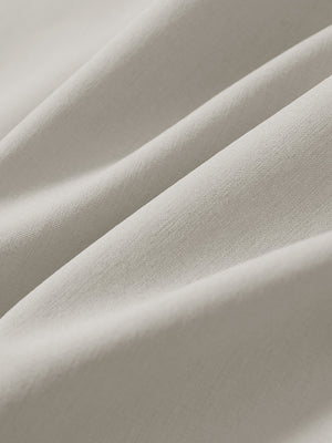 Macro view of the light khaki stretch soft flat front dress golf shorts fabric, showcasing the smooth texture