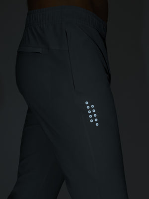 Dark grey superion softness mesh joggers with zipper pockets glowing in the dark