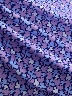 Close-up of pink purple flower performance quick dry print golf polos fabric texture