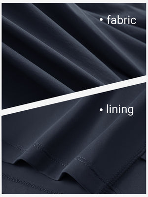 Close-up texture of navy blue women's moisture-wicking athletic tennis skirts fabric showing detailed outer and inner lining material.