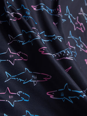Macro view of the ombre shark 4 way stretch print collared polo shirt fabric, showcasing the unique print design